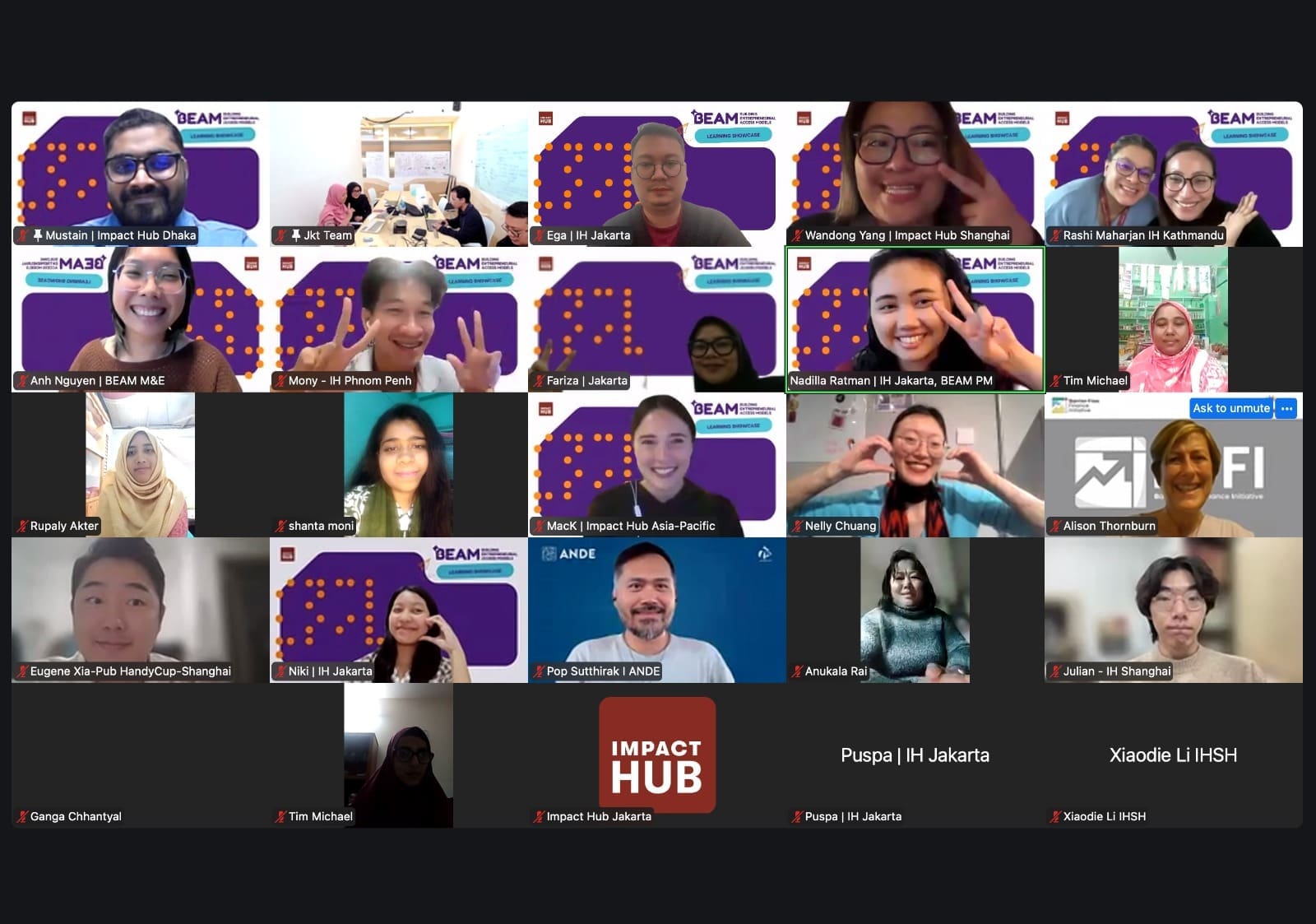 A Zoom gallery view showing dozens of participants from the BEAM network and Impact Hub communities across Asia-Pacific. The screen features diverse faces smiling, waving, and making heart and peace hand gestures. Many frames include branded BEAM purple backgrounds and Impact Hub location labels (Jakarta, Shanghai, Dhaka, Kathmandu, Phnom Penh, and more), capturing a warm, collaborative virtual gathering across countries